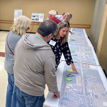 Small group of people looking at a map on a table